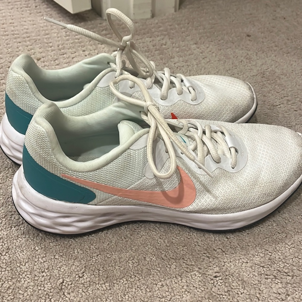 orange and teal women’s nike revolution shoes